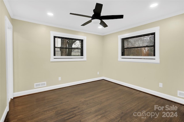 unfurnished room featuring ceiling fan, crown molding, and dark wood-type flooring