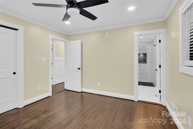 unfurnished bedroom with crown molding, dark hardwood / wood-style floors, connected bathroom, and ceiling fan