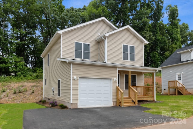 view of front of house with a garage and covered porch