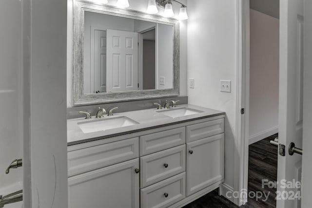 bathroom featuring vanity and hardwood / wood-style flooring