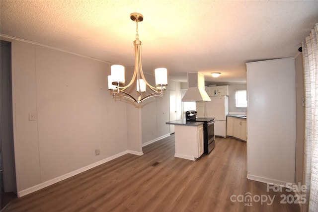 kitchen with decorative light fixtures, white cabinetry, dark hardwood / wood-style flooring, island range hood, and stainless steel range with electric stovetop