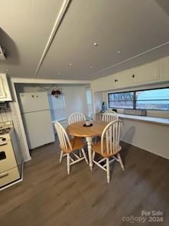 dining area with dark wood-type flooring