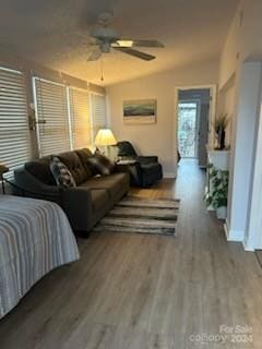 interior space with wood-type flooring and ceiling fan