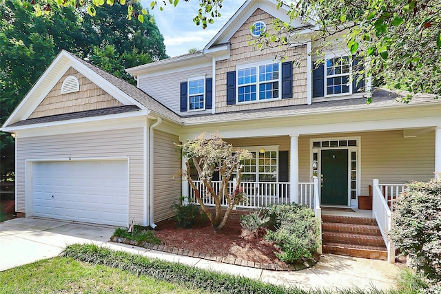 view of front of house with a garage and covered porch