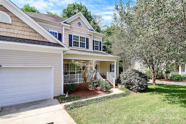 view of front of property with a porch, a garage, and a front yard