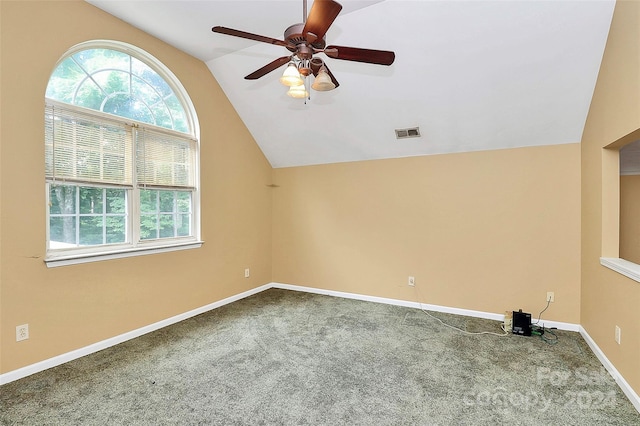 additional living space featuring lofted ceiling, ceiling fan, and carpet flooring