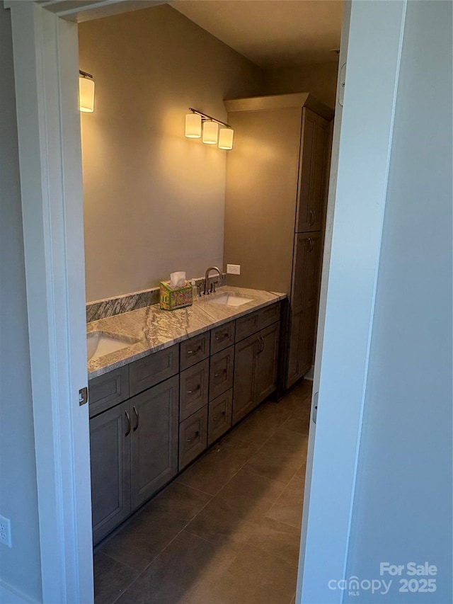 bathroom featuring tile patterned floors and vanity