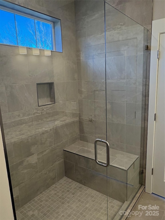 bathroom featuring an enclosed shower