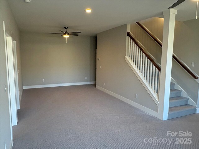 interior space with ceiling fan and light colored carpet