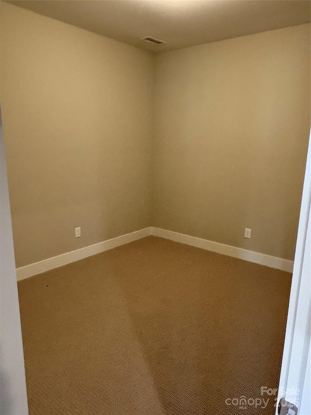 unfurnished room with carpet floors