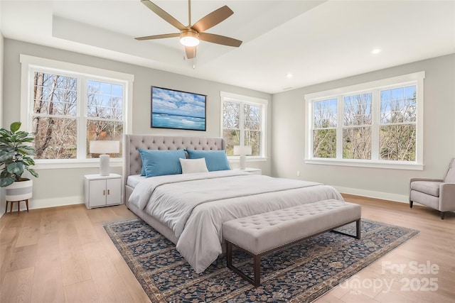 bedroom featuring light wood-type flooring, baseboards, and recessed lighting