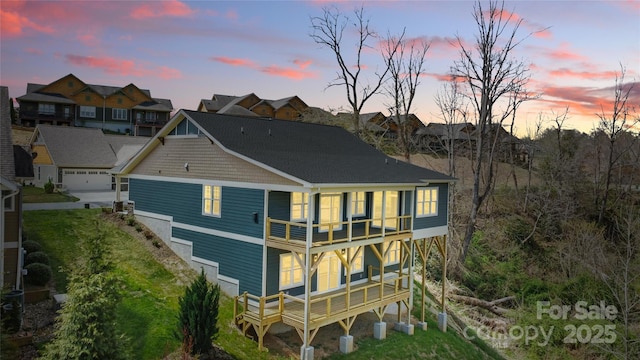 rear view of house featuring a residential view and a balcony