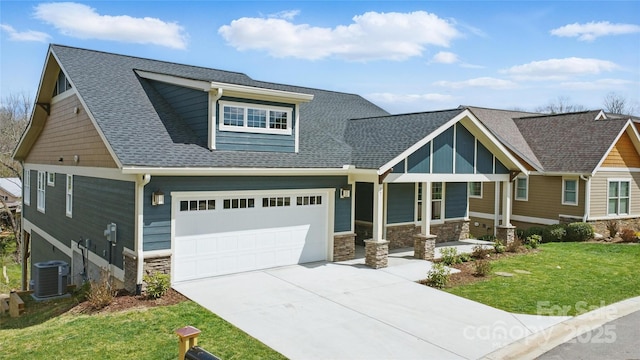 craftsman-style house with concrete driveway, cooling unit, stone siding, and a front lawn