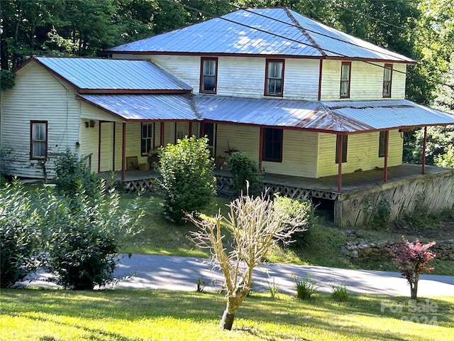 view of front of home with a front lawn and a porch