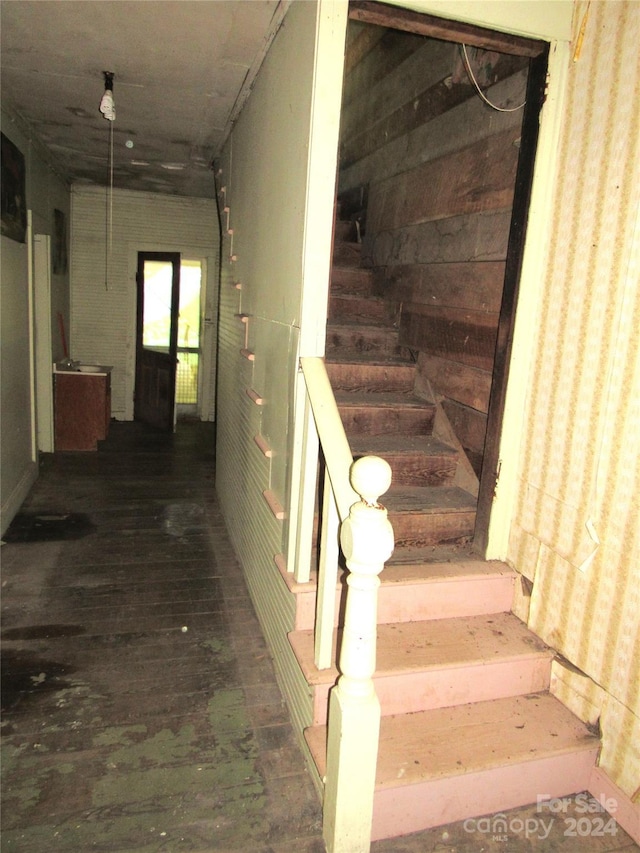 stairs with hardwood / wood-style floors