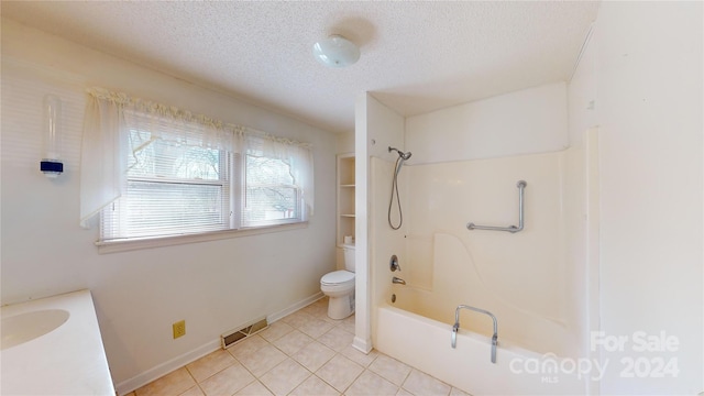 full bathroom with toilet, shower / washtub combination, tile floors, a textured ceiling, and vanity