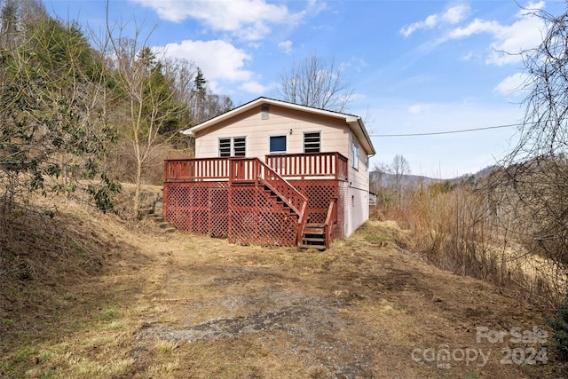 exterior space with a wooden deck