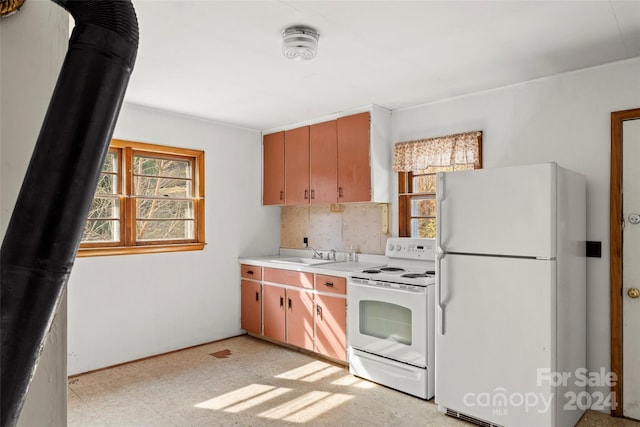 kitchen featuring white appliances, sink, light tile floors, and tasteful backsplash