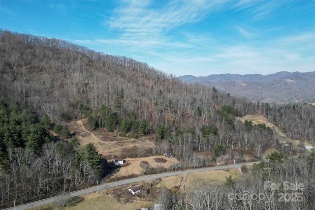 mountain view featuring a view of trees