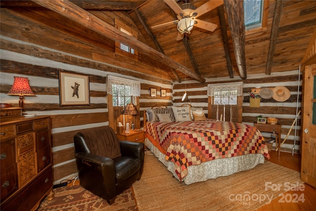 bedroom with wooden ceiling, multiple windows, vaulted ceiling with beams, and hardwood / wood-style flooring