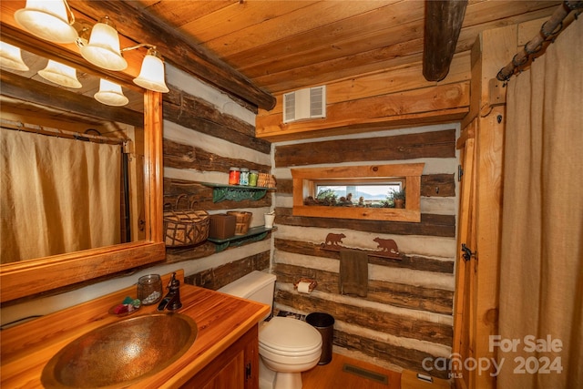 bathroom with vanity, toilet, wood ceiling, and wooden walls