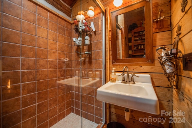 bathroom with an enclosed shower and sink