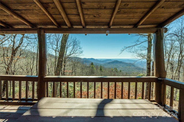 wooden deck featuring a mountain view