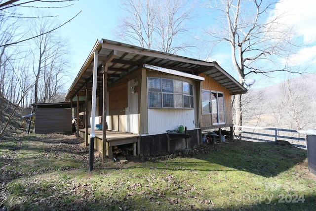 view of property exterior featuring a yard