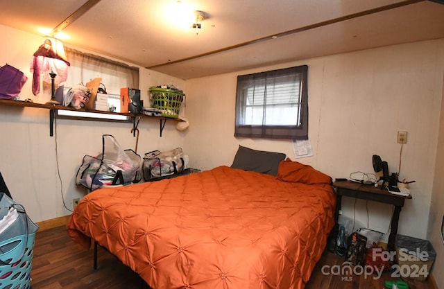 bedroom featuring dark wood-type flooring