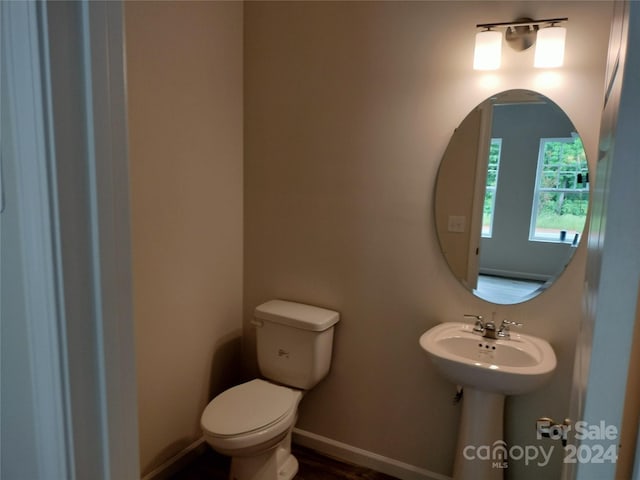 bathroom featuring toilet and sink