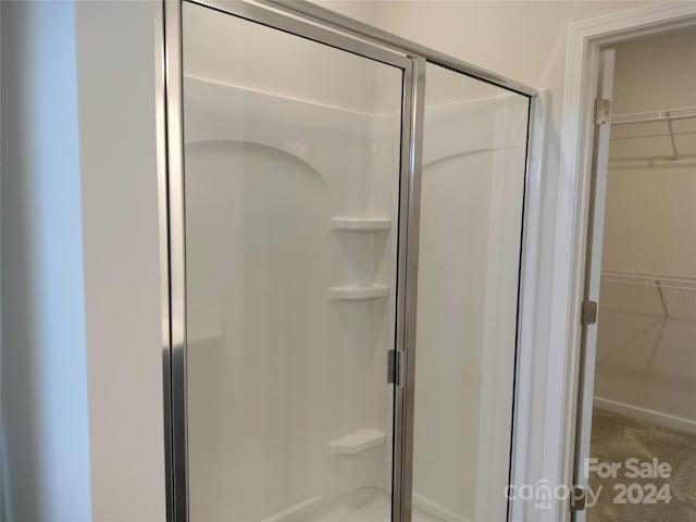 bathroom featuring an enclosed shower