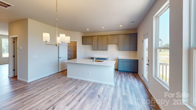 4223 S New Hope Rd Unit 8, Gastonia, NC 28056 - kitchen with a chandelier, light wood-style floors, a center island with sink, decorative light fixtures, and recessed lighting