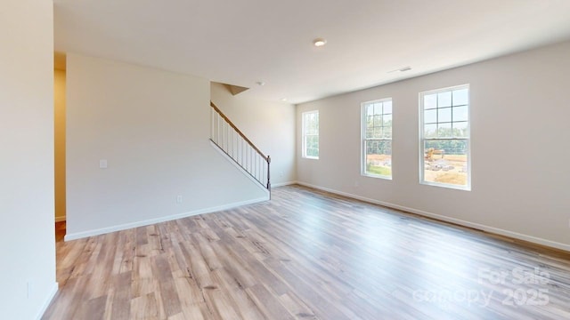 4223 S New Hope Rd Unit 8, Gastonia, NC 28056 - spare room with stairs and light wood-type flooring