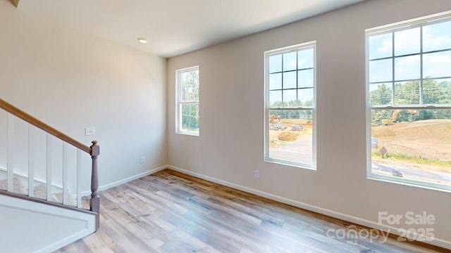 4223 S New Hope Rd Unit 8, Gastonia, NC 28056 - spare room with light wood-type flooring and stairs