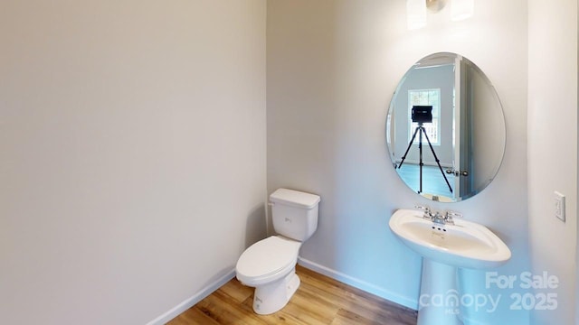 4223 S New Hope Rd Unit 8, Gastonia, NC 28056 - half bathroom featuring baseboards and wood finished floors