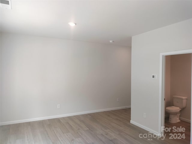 spare room with light hardwood / wood-style flooring