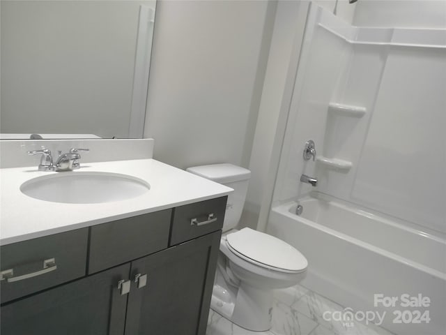 full bathroom featuring washtub / shower combination, vanity, and toilet