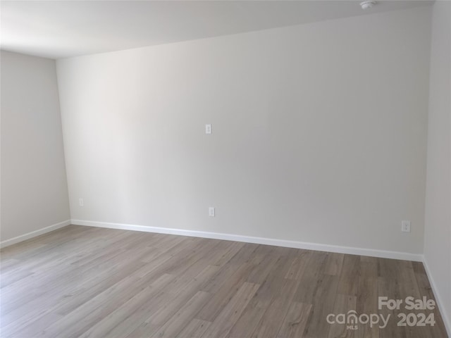 spare room featuring light hardwood / wood-style floors