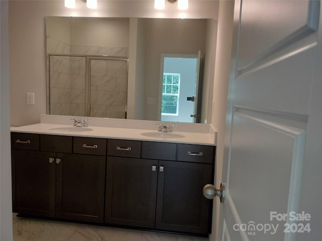 bathroom with vanity and walk in shower