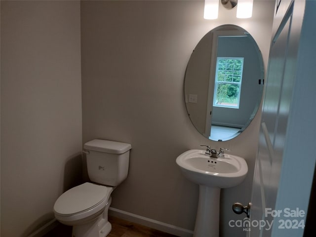 bathroom featuring toilet and sink