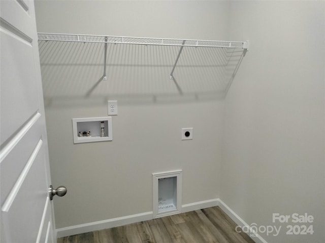 laundry area featuring electric dryer hookup, hardwood / wood-style floors, and washer hookup