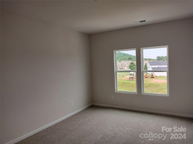 empty room with carpet flooring