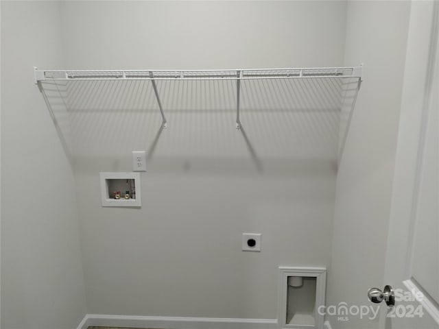 laundry area with hookup for an electric dryer and washer hookup