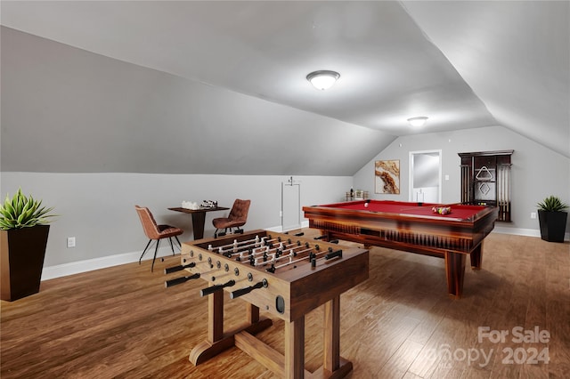 game room featuring hardwood / wood-style floors, vaulted ceiling, and billiards