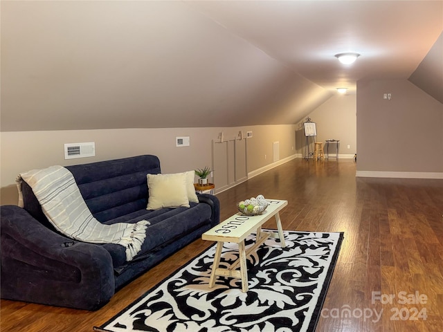 interior space with lofted ceiling and wood-type flooring