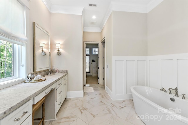 bathroom featuring crown molding, tile floors, oversized vanity, and a bathtub