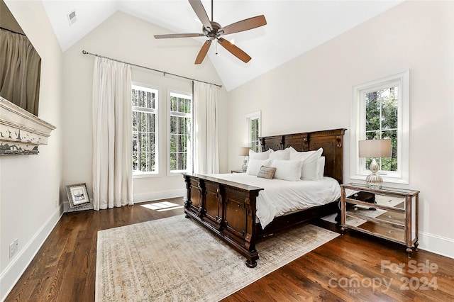 bedroom featuring multiple windows, ceiling fan, and dark hardwood / wood-style floors