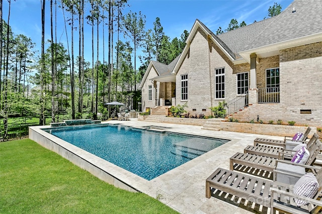 view of swimming pool featuring a lawn and a patio area