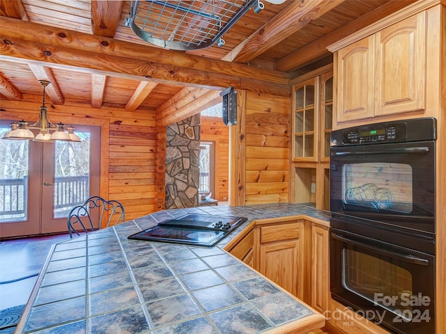 kitchen with rustic walls, black appliances, light brown cabinets, beam ceiling, and wooden ceiling