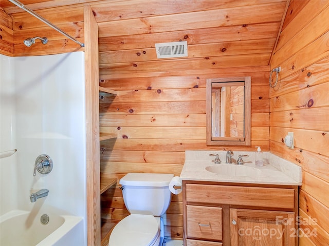 full bathroom with vanity, wooden walls, vaulted ceiling, toilet, and shower / bathtub combination